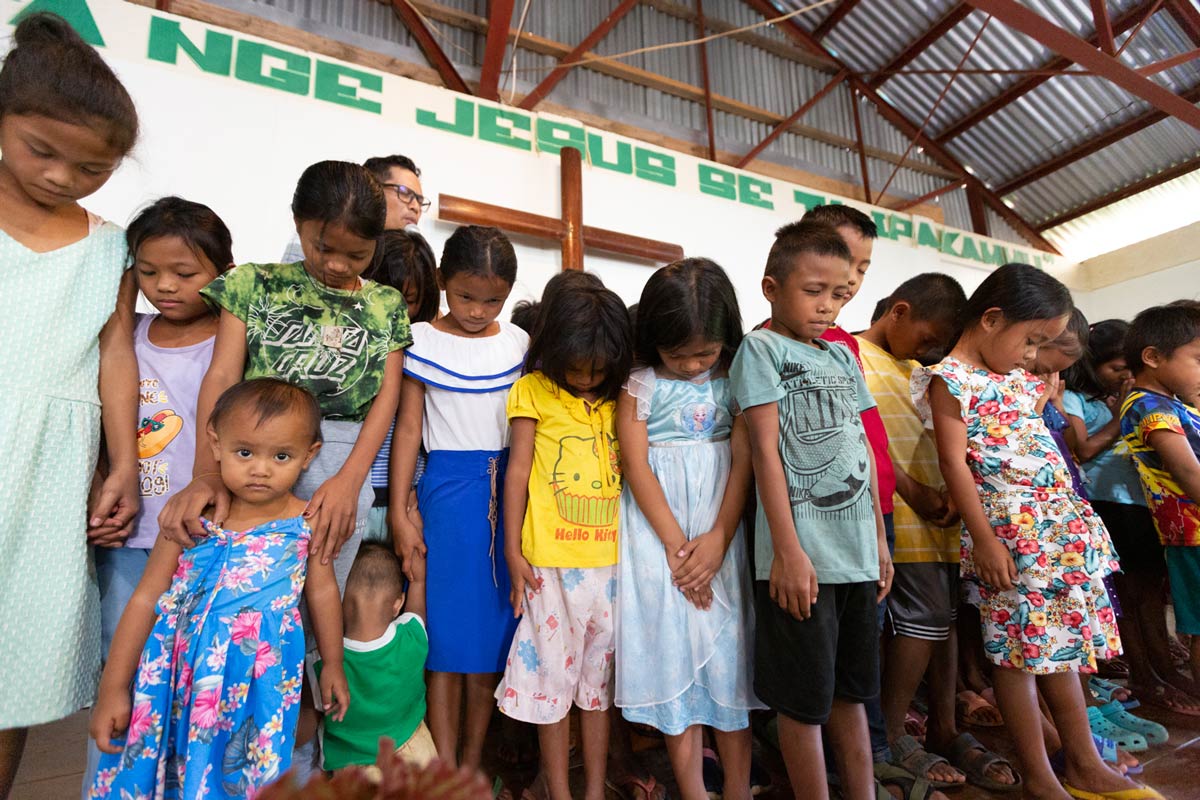 Young Isnag children are prayed over as part of the dedication.